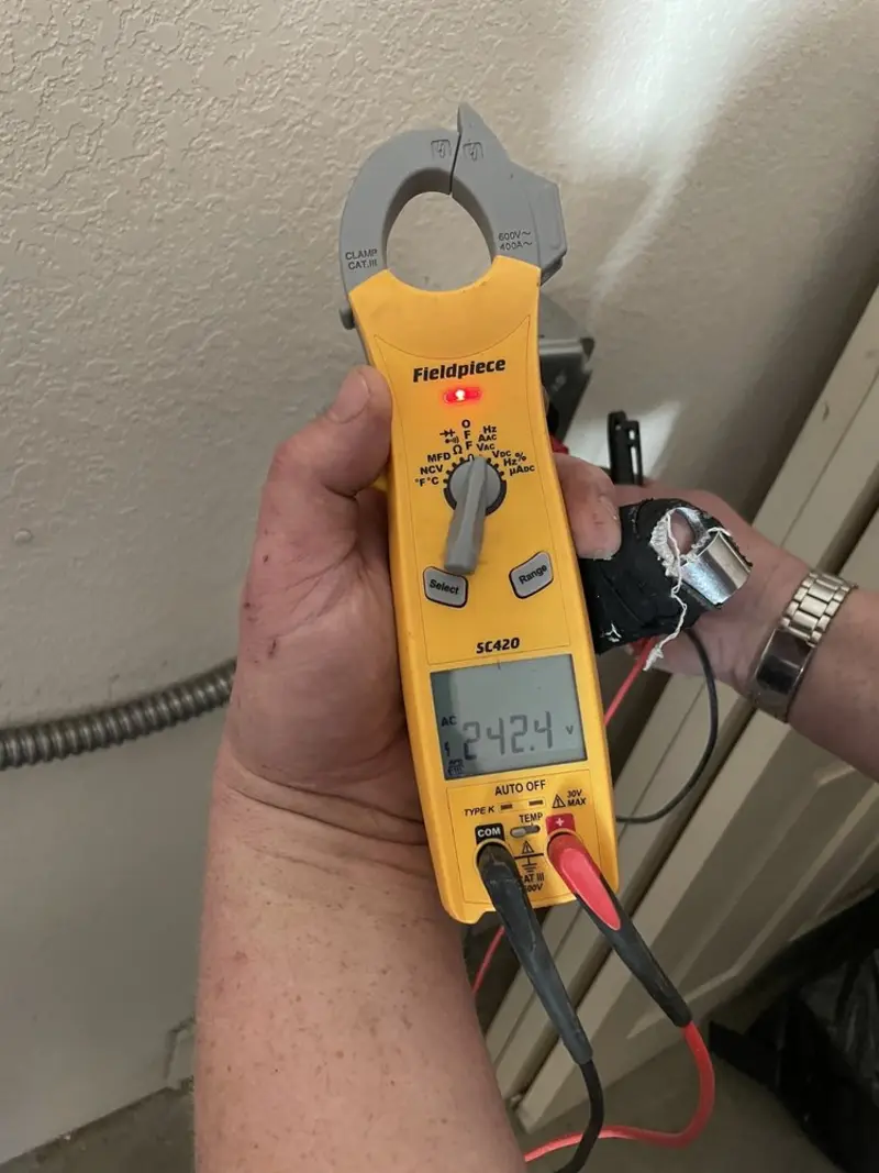 Voltage testing with clamp meter during Recessed Lighting Installation in Coolbaugh